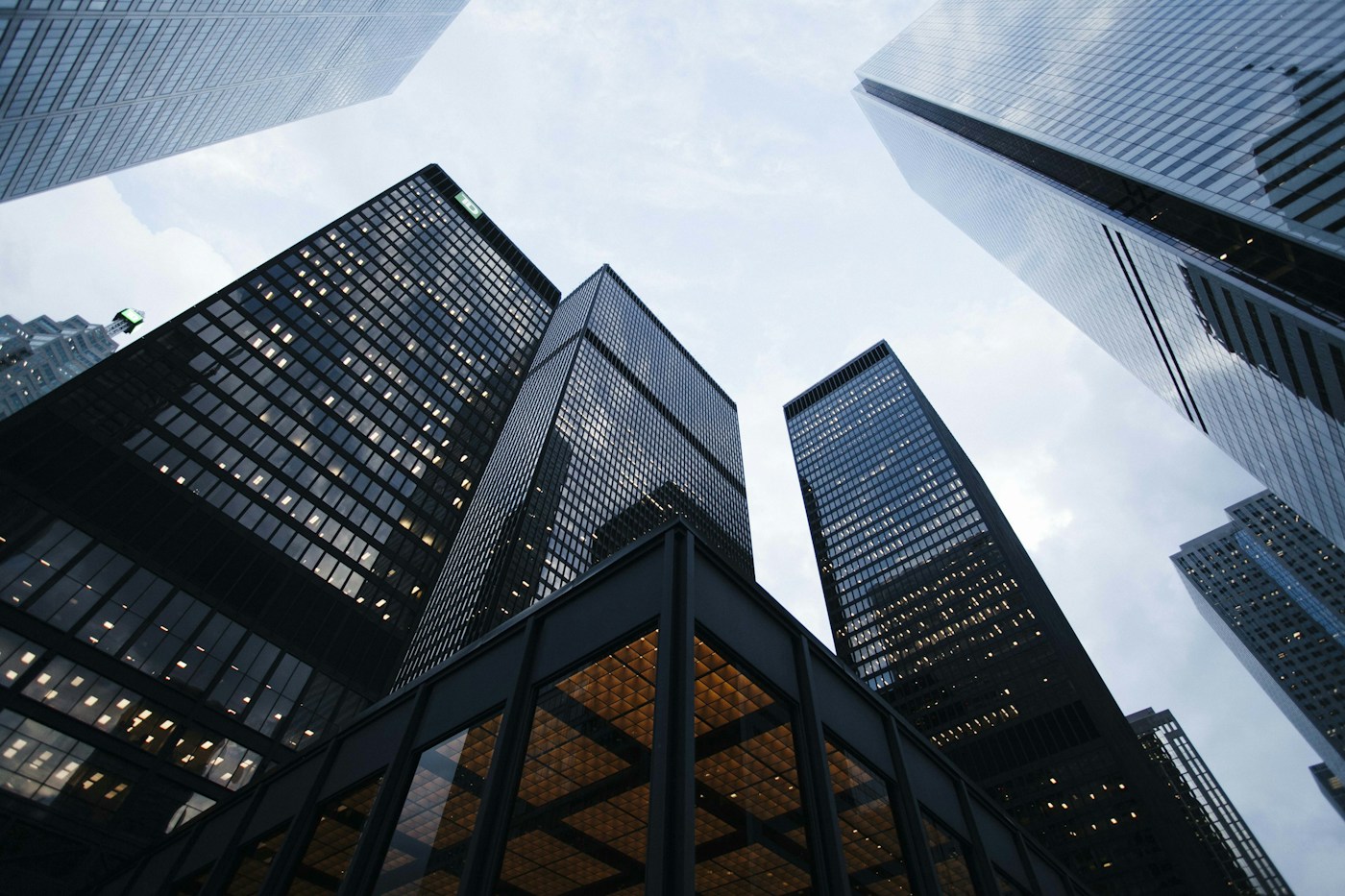 Modern glass commercial towers viewed from street level